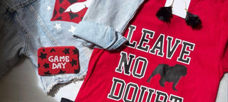 red and black flatlay of denim jacket and bulldogs tshirt