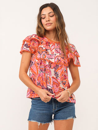 playful paisley print blouse in red and orange with lacey details and ruffled short sleeves