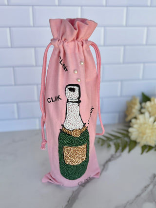 pink beaded wine bag with champagne bottle