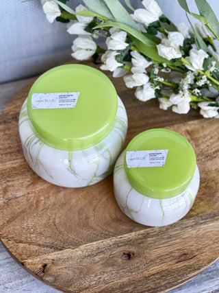 white marble honey dew scented candle with bright green top