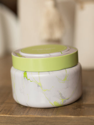 honey dew scented candle in bright white and green travel tin