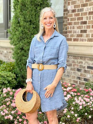 breezy linen chambray blue button down dress with collared neckline and fringe shirt cut hem