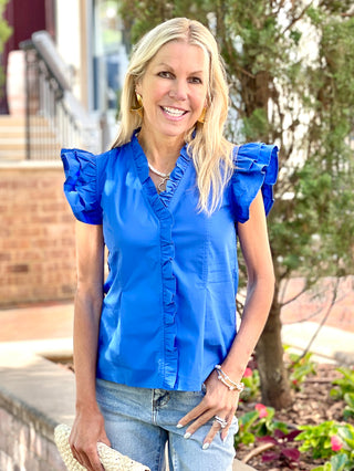 vibrant royal blue top with ruffled details and double flutter short sleeves