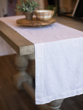 a white table runner with an enhanced trim great for farmhouse style home decor and dinner parties