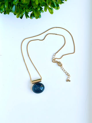 crafted navy pebble charm necklace on a gold chain with lobster clasp