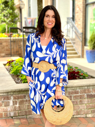 beachy blue patterned collared dress with three quarter wide sleeves worn with weave belt