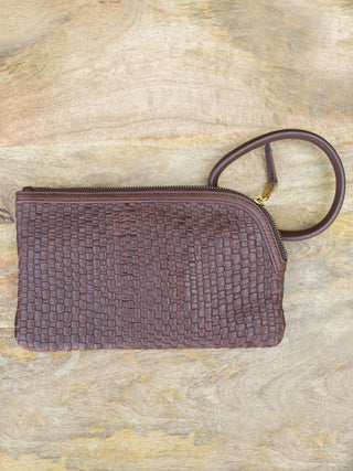 a woven bracelet clutch in dusty purple with vintage vibes perfect for fall fashion accessorizing