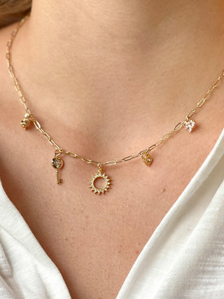 sweet gold chain charm necklace with five delicate charms symbolizing love and freedom