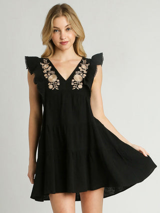 charming black tiered mini dress with playful ruffle sleeves and embroidered flower details