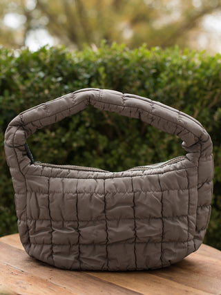 wear this gray quilted handbag as an everyday accessory or gift for the christmas and holiday season