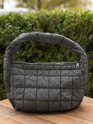 wear this black quilted handbag as an everyday accessory or gift for the christmas and holiday season