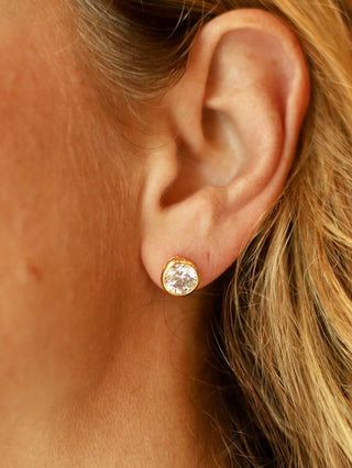 a pair of clear gemstone gold earrings perfect for everyday wear