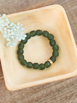 a green sea glass beaded bracelet with gold details great for everyday jewelry wear and small gifts