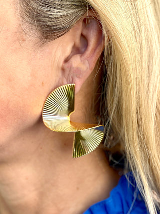 large golden spiral stair statement earrings