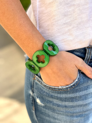 bright green chunky quatrefoil pattern resign bracelets with stretchy design perfect for spring