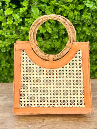 small boho cane weave and cognac leather handbag perfect for warm weather
