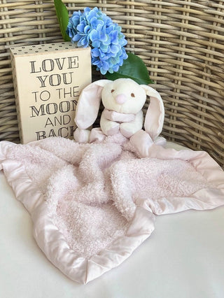 soft and sweet barefoot dreams bunny buddie with blue knit blanket and satin trim