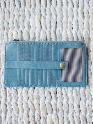 sky blue vegan leather wallet with cardholder exterior card pockets and zipper closure