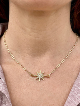 north star gold pendant starburst sun necklace with rhinestones on a delicate paperclip chain