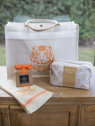 an easy tiger jute tote bag with a front pocket featuring an orange tiger face on a white background shown with clemson pride