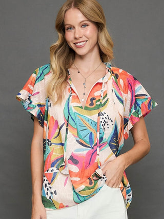 abstract multi colored print short sleeve top with v neck tie 