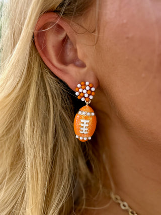 orange and white football stud earring