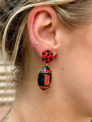 black and red football earrings