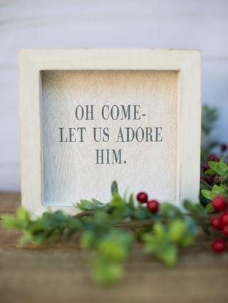 a christmas wall decor piece that reads oh come let us adore him perfect for holiday home decor and host gifts