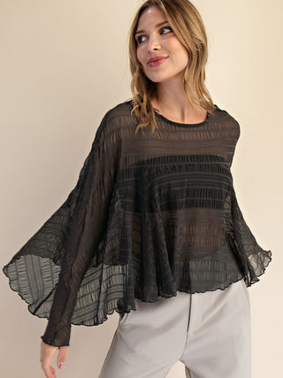 black long sleeve sheer cape top with asymmetrical hem