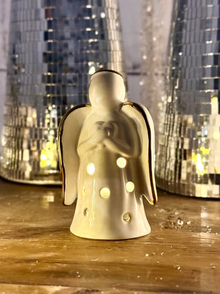 a light up praying angel sitter decoration