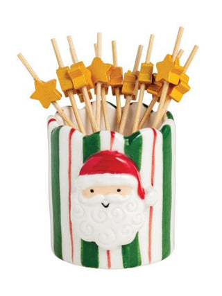 a ceramic santa toothpick holder with yellow star toothpicks