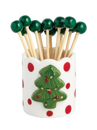 a ceramic christmas tree toothpick holder with green toothpicks