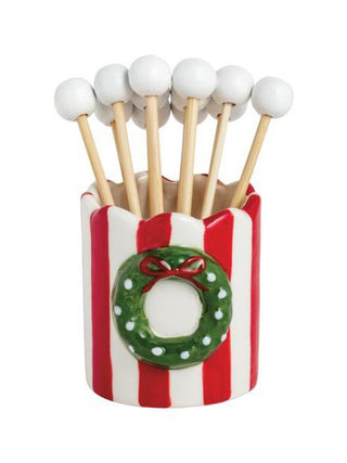 a ceramic christmas wreath toothpick holder with white toothpicks