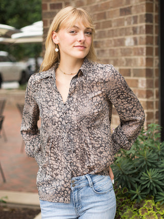 a leopard print blouse in lightweight fabric with dramatic long sleeves perfect for transitional dressing