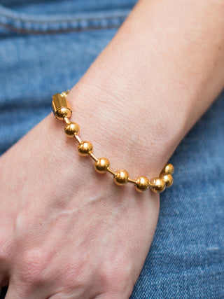a gold ball chain bracelet