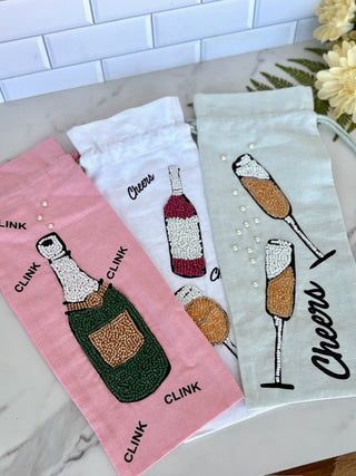 three beaded wine bags