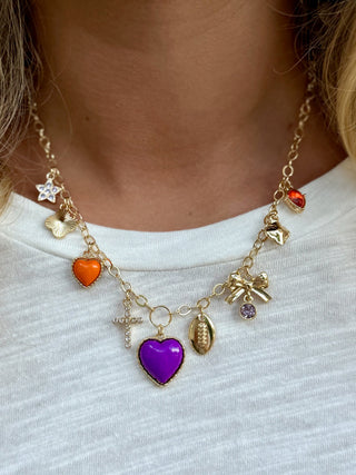 gold necklace with purple and orange hearts and a football charm for clemson spirit