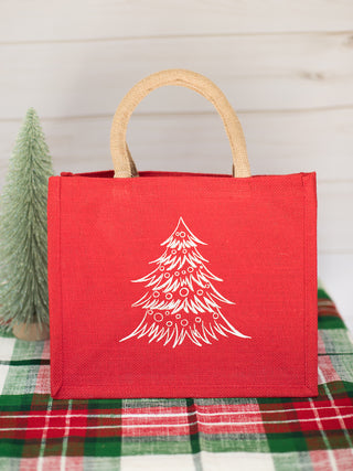 a red holiday present bag with a white christmas tree perfect for home decor and host gifts