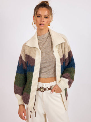 a soft long sleeve collared cardigan with a western alpine landscape pattern