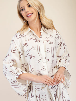 white button down top features a maroon bow printed pattern