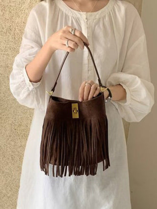 an adjustable chocolate brown bucket fringe western style bag