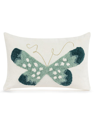 a white decorative pillow with a fluffy blue and green butterfly design