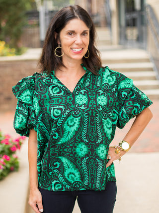 an emerald and black short sleeve blouse with dramatic puff sleeves for moody fall and winter fashion