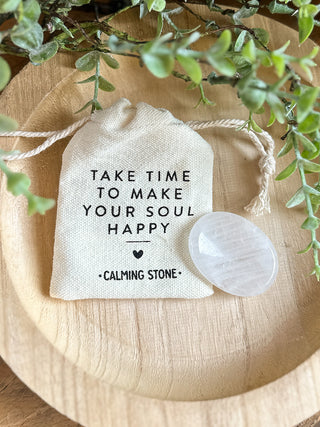 a clear quartz stone with a gift bag that reads take time to make your soul happy calming stone perfect for gifts