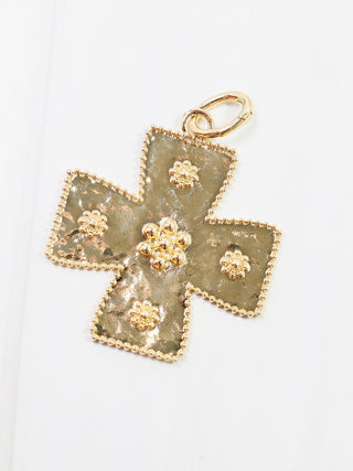 gold cross charm with beaded detailing