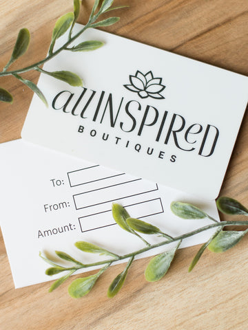 a white all inspired gift card with logo and text in black and space to write to from and amount