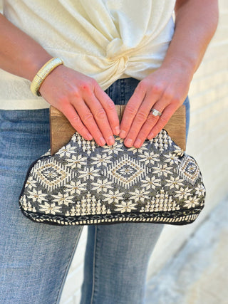 a chic black and cream beaded tribal pattern clutch