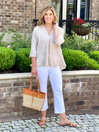 flattering cobblestone linen top with three quarter sleeves and relaxed fit worn with white pants