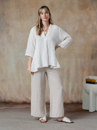 flattering cobblestone linen top with three quarter sleeves and relaxed fit worn with natural pants