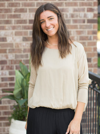 a soft gold italian silk blouse with semi sheer three quarter sleeves perfect for luxury everyday dressing and fall fashion